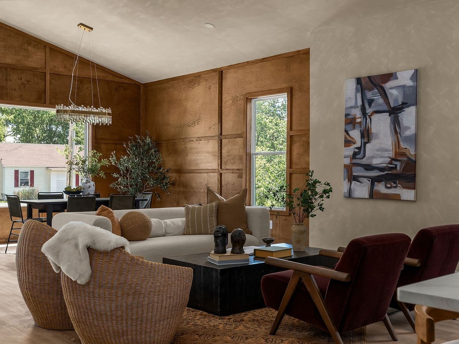Vaulted great room with warm wood accent wall.