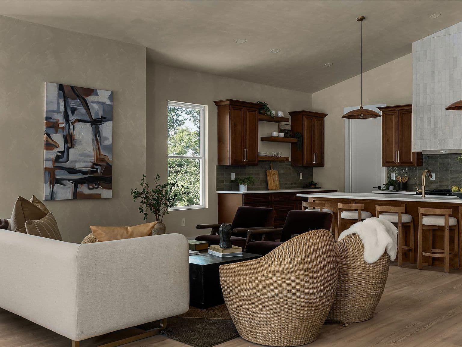 Open living flows into bespoke quartz kitchen.