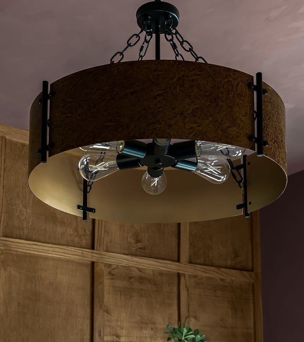 Rustic-modern drum chandelier for warm ambient glow.