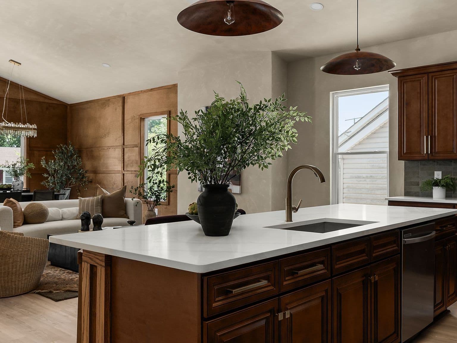 Quartz waterfall island anchors the open-concept living space.