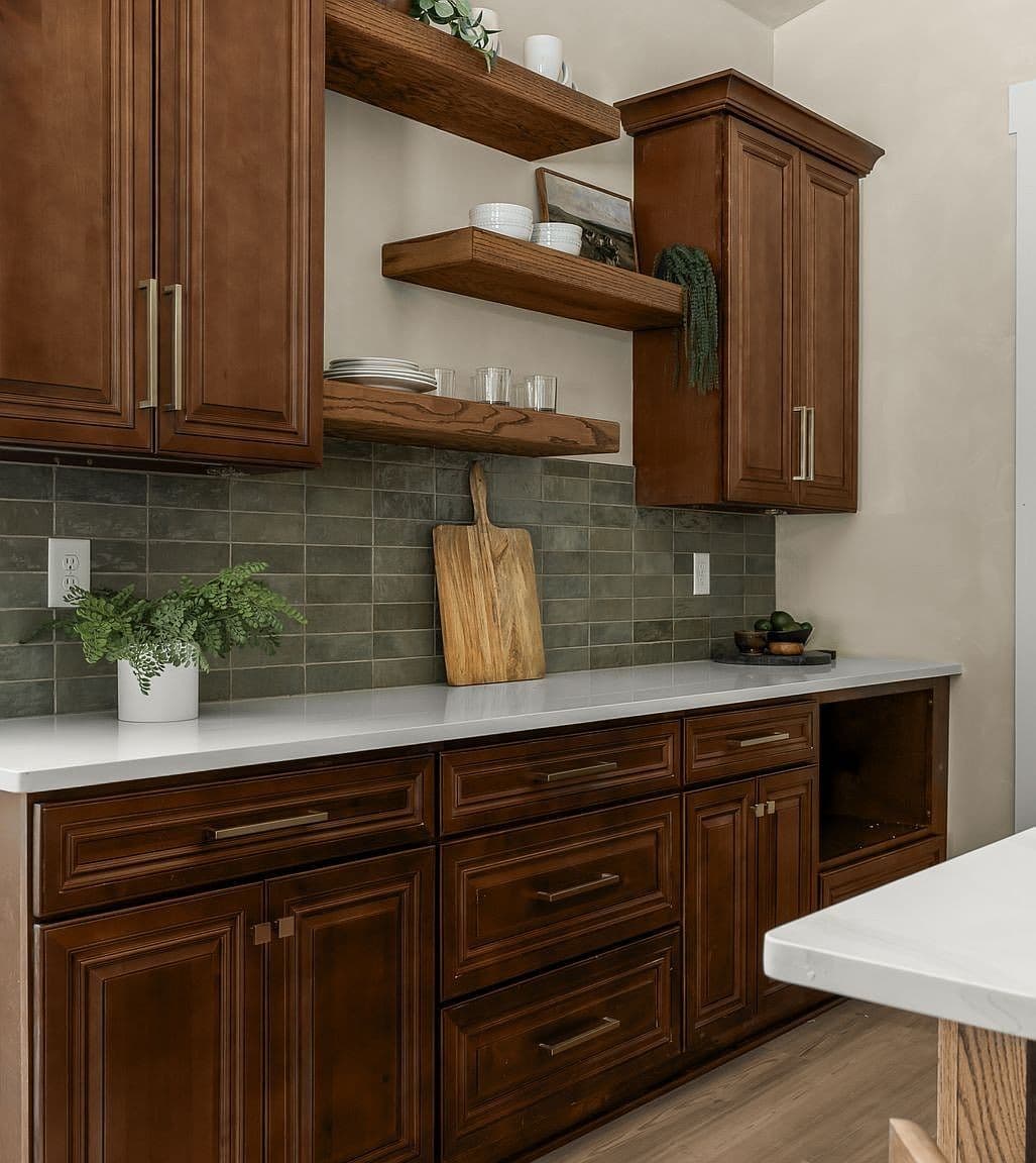 Floating wood shelves and tile backsplash elevate prep space.