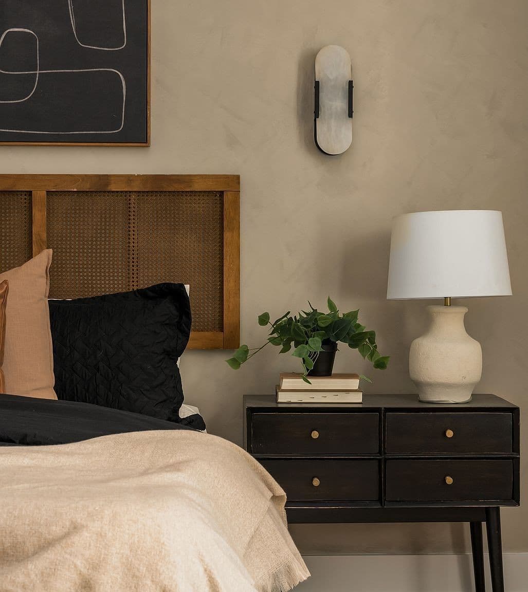 Custom nightstand vignette with warm textures and upscale finishes.