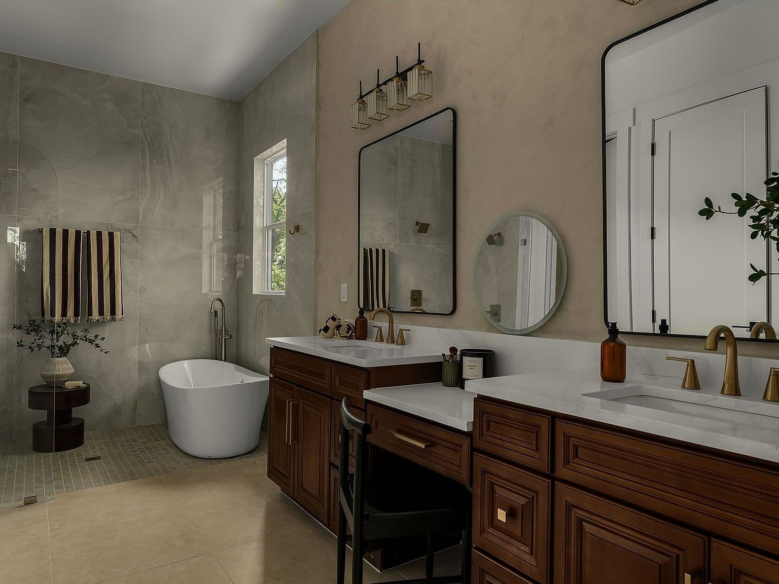 Spa-inspired bath with double vanity and freestanding soaking tub.