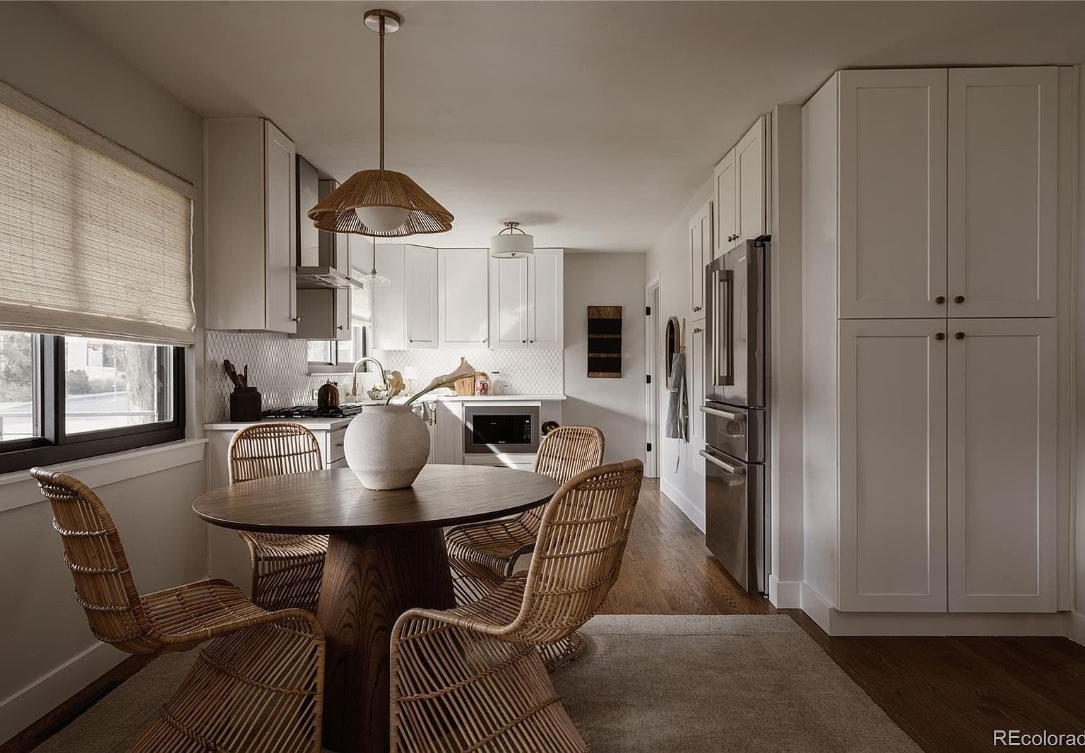 Bright kitchen and dining area offer stylish everyday gathering.