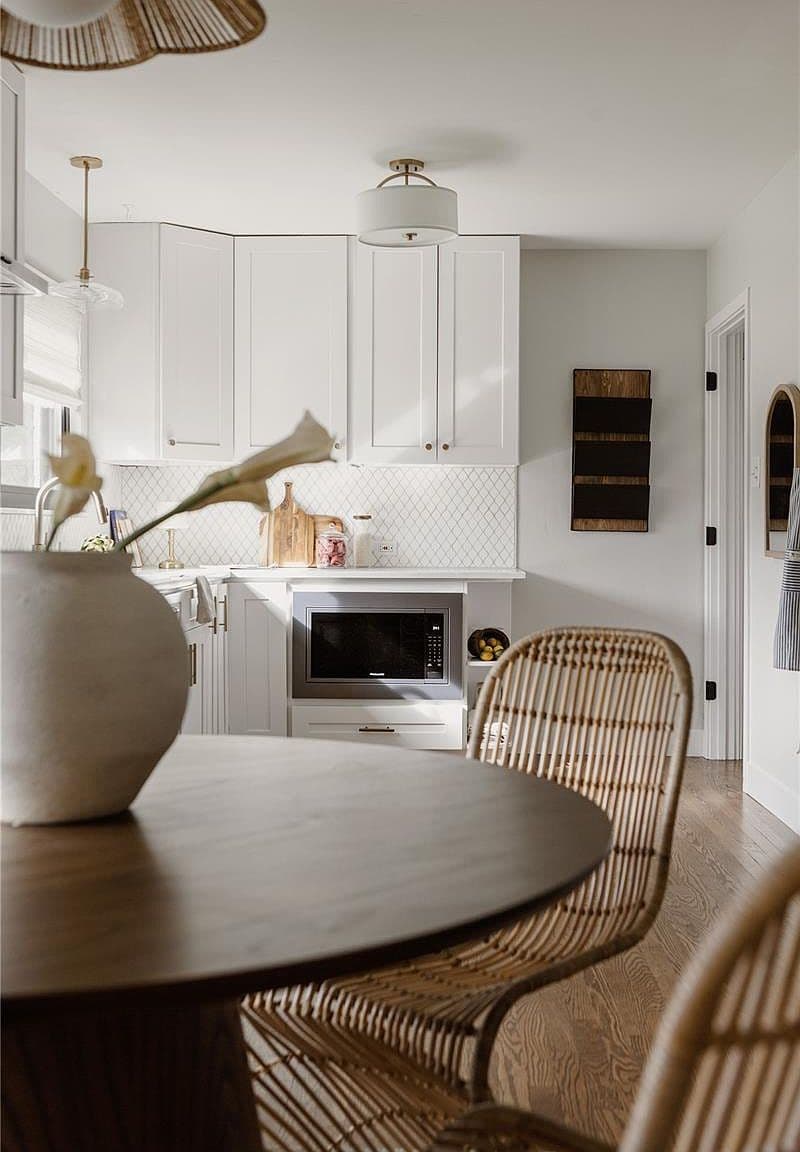 Cozy dining nook overlooks the bright, beautifully appointed kitchen.
