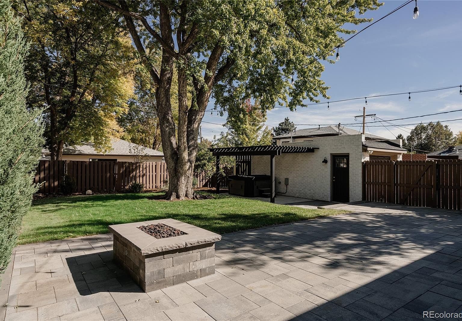Spacious patio features an in-ground gas fire pit.