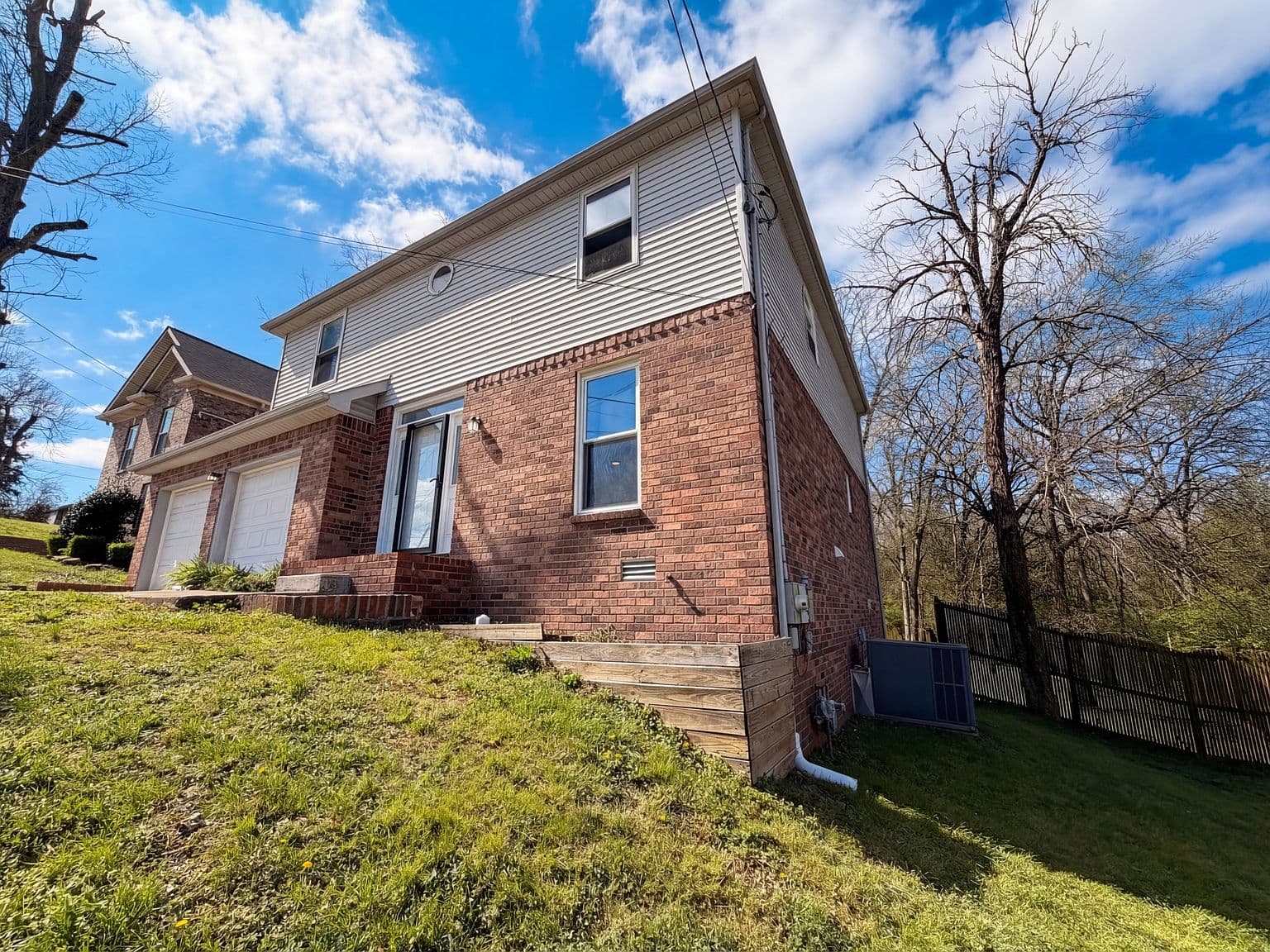 Elevated lot with serene wooded views behind.