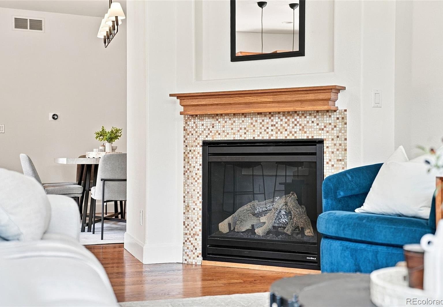 Cozy gas fireplace focal point with designer tile surround.