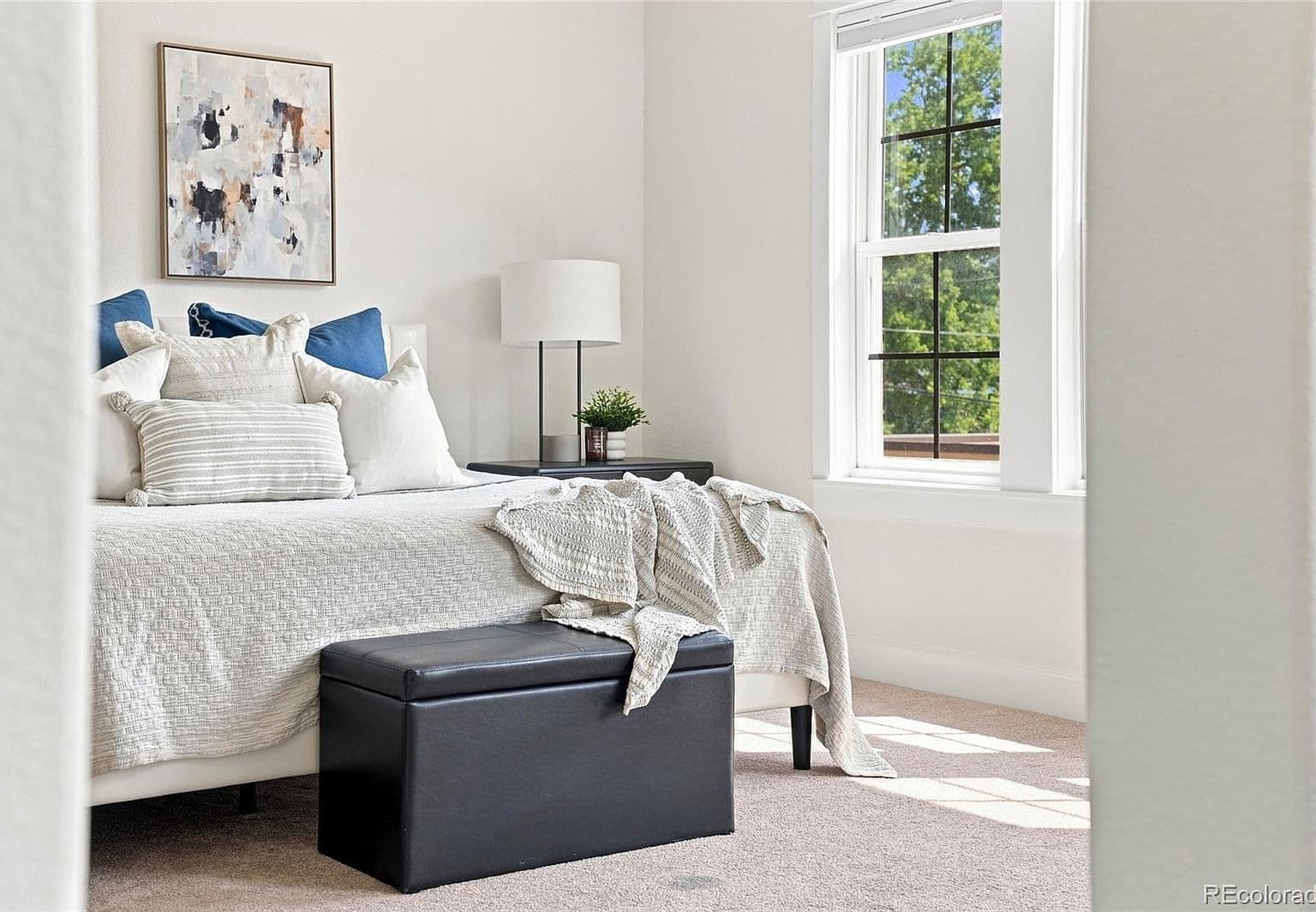 Serene bedroom retreat with abundant natural light.