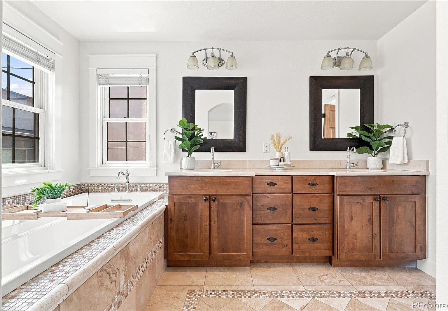 Spa-inspired bath with dual vanity and soaking tub.