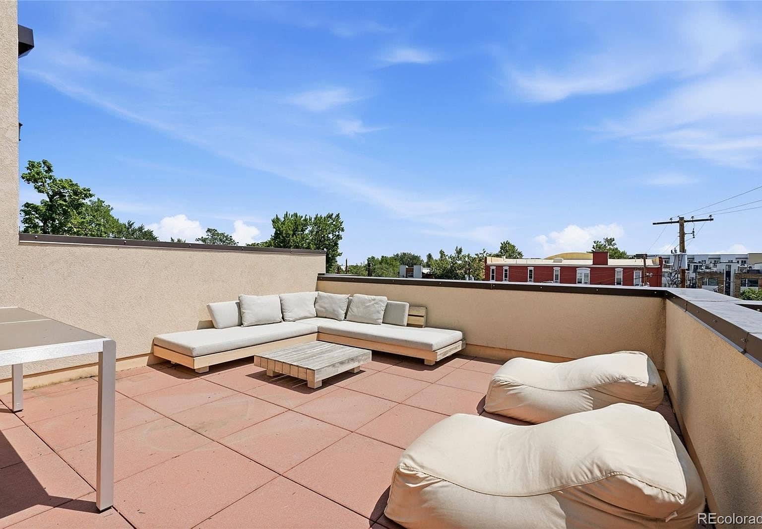 Rooftop-style patio lounge with expansive Denver skies.