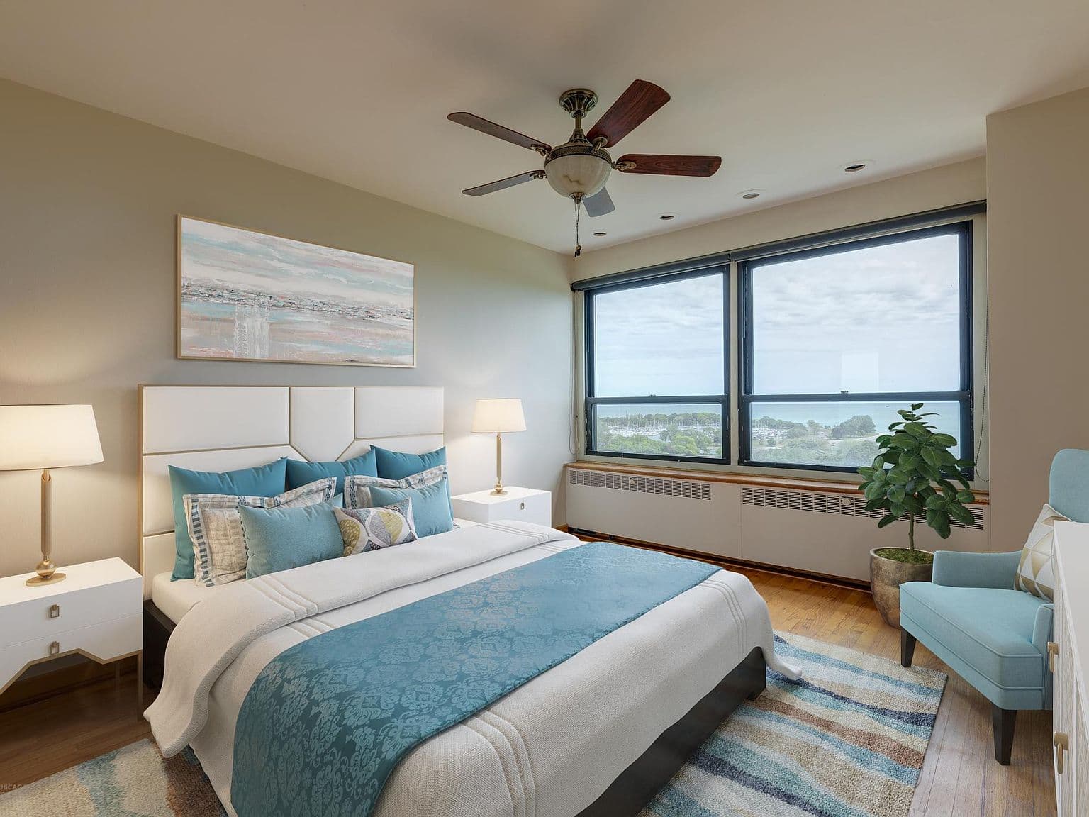 Staged bedroom pairs a king-size bed with lake views.