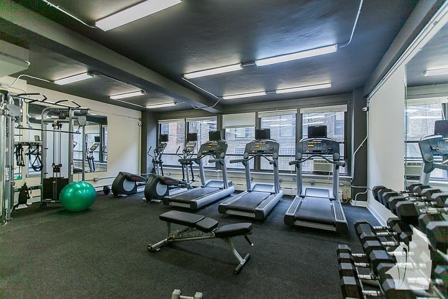 Fitness center offers cardio machines and free weights.