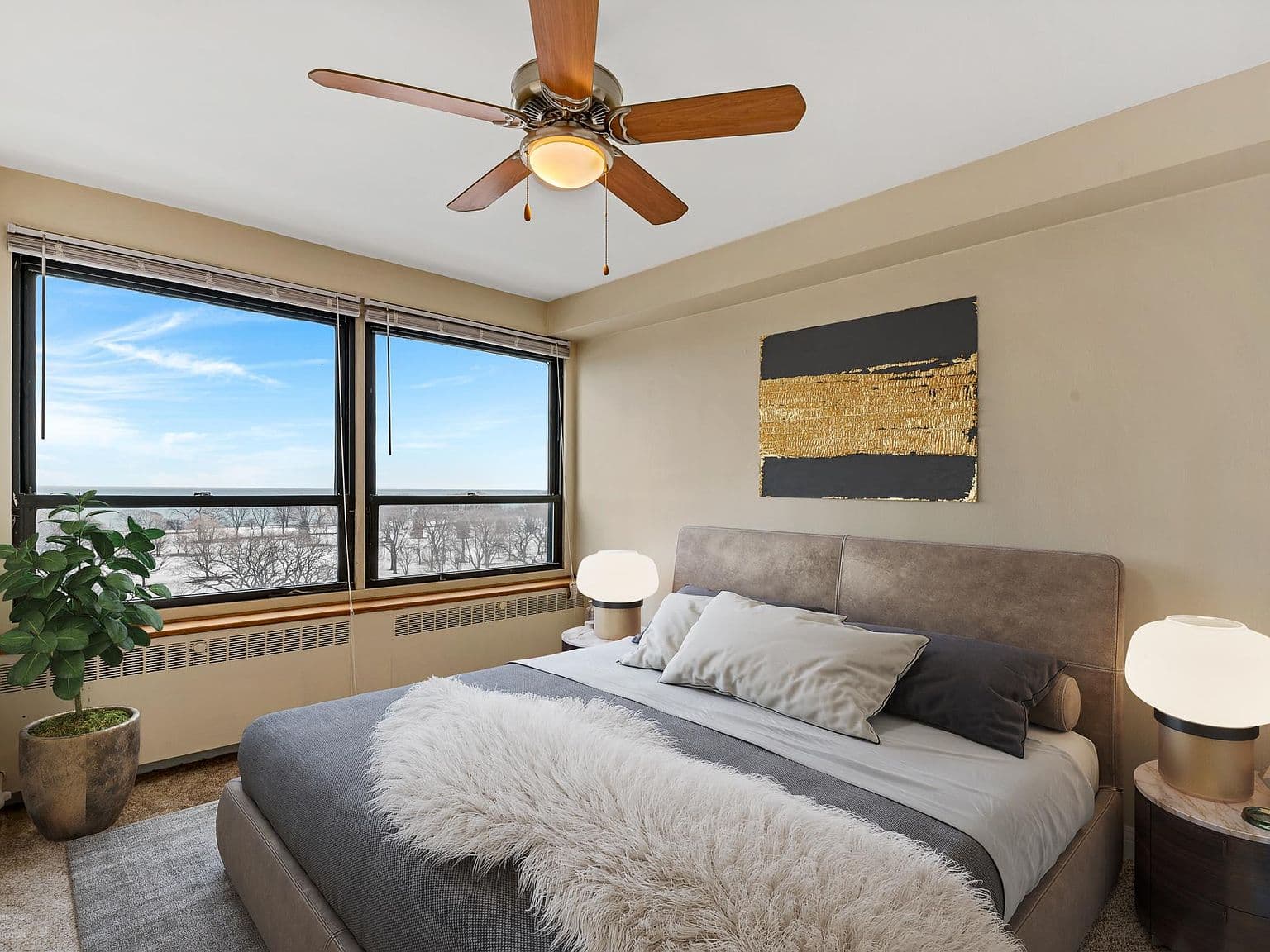 Spacious bedroom pairs king-size comfort with lake views.