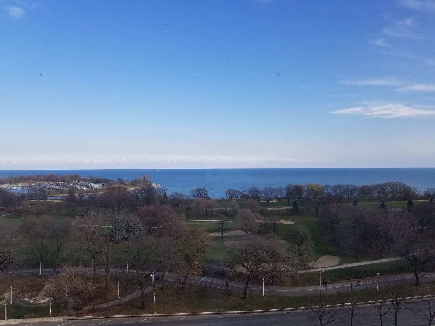 Sweeping lake views stretch beyond the green parkland.