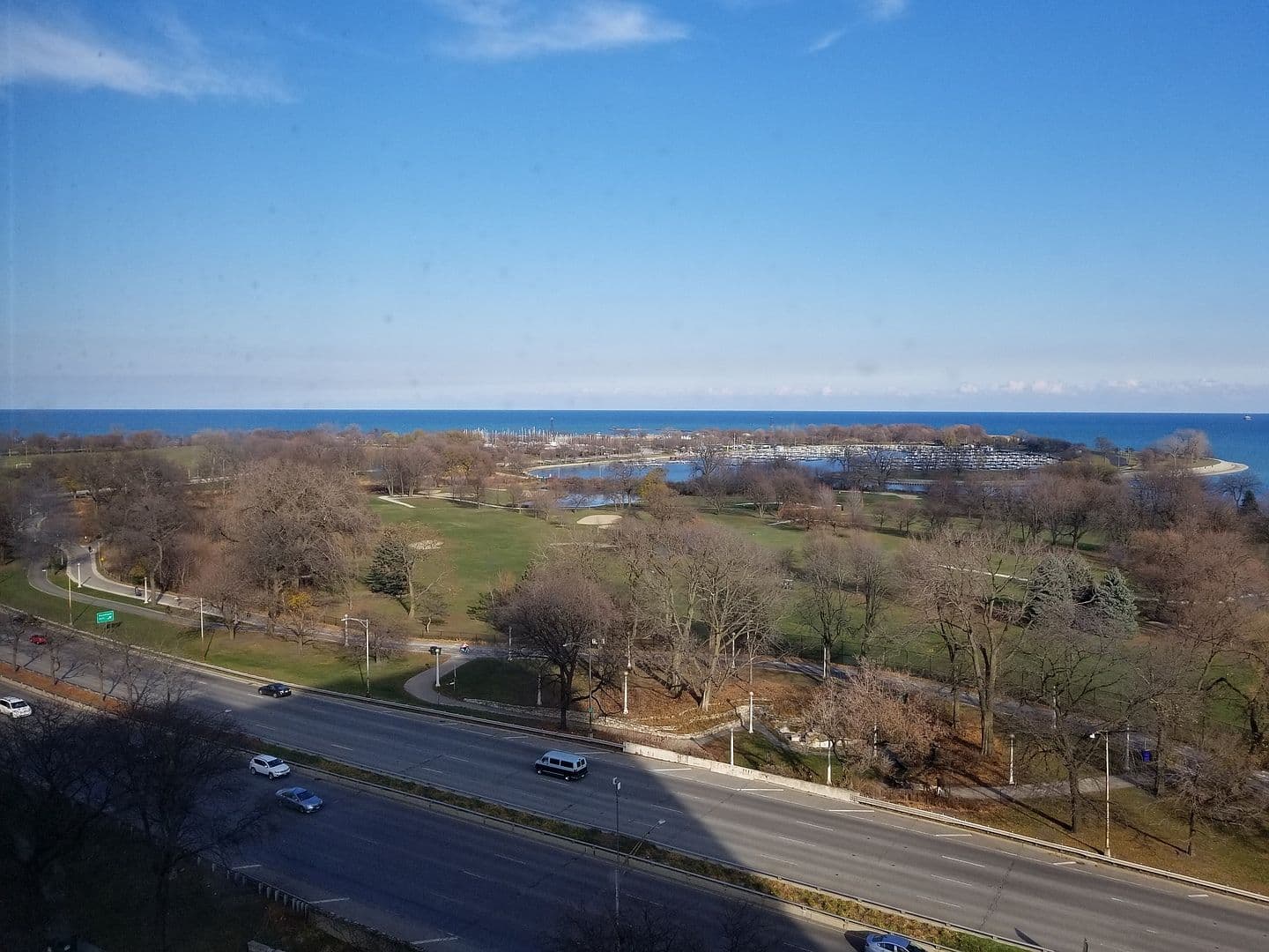 A sweeping panorama captures the harbor and lakeside greens.