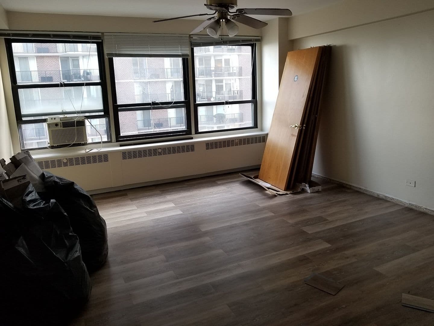 Another bedroom view highlights natural light and flexible space.