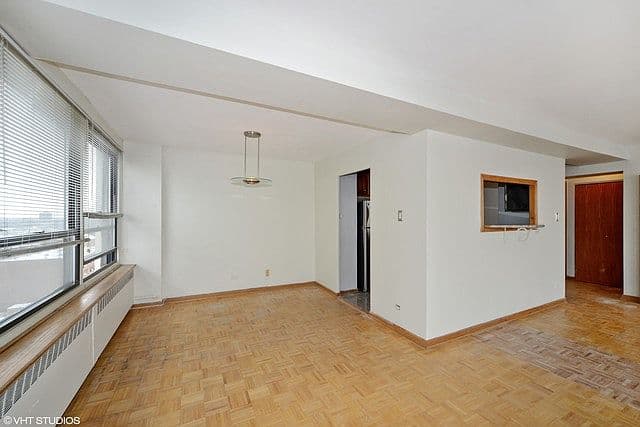 Dining area sits beside the kitchen pass-through and windows