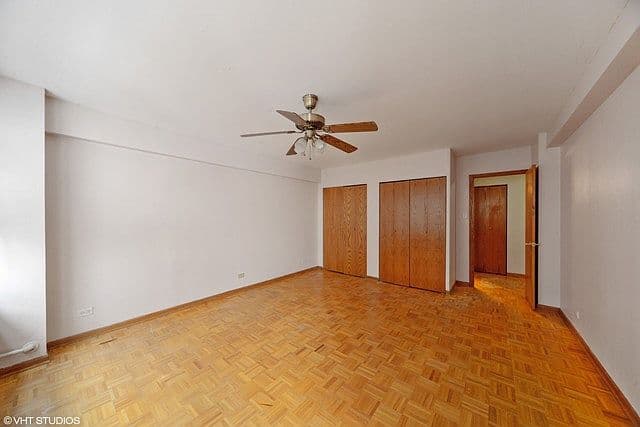 Spacious bedroom features hardwood floors and ample closet space
