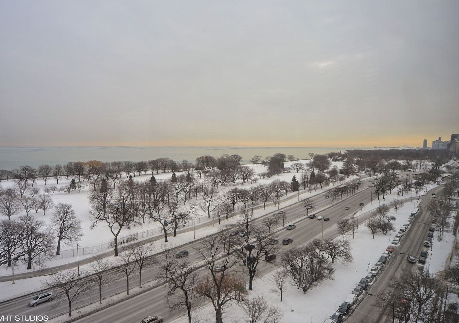 East-facing lake outlook overlooks a snow-covered lakefront park.