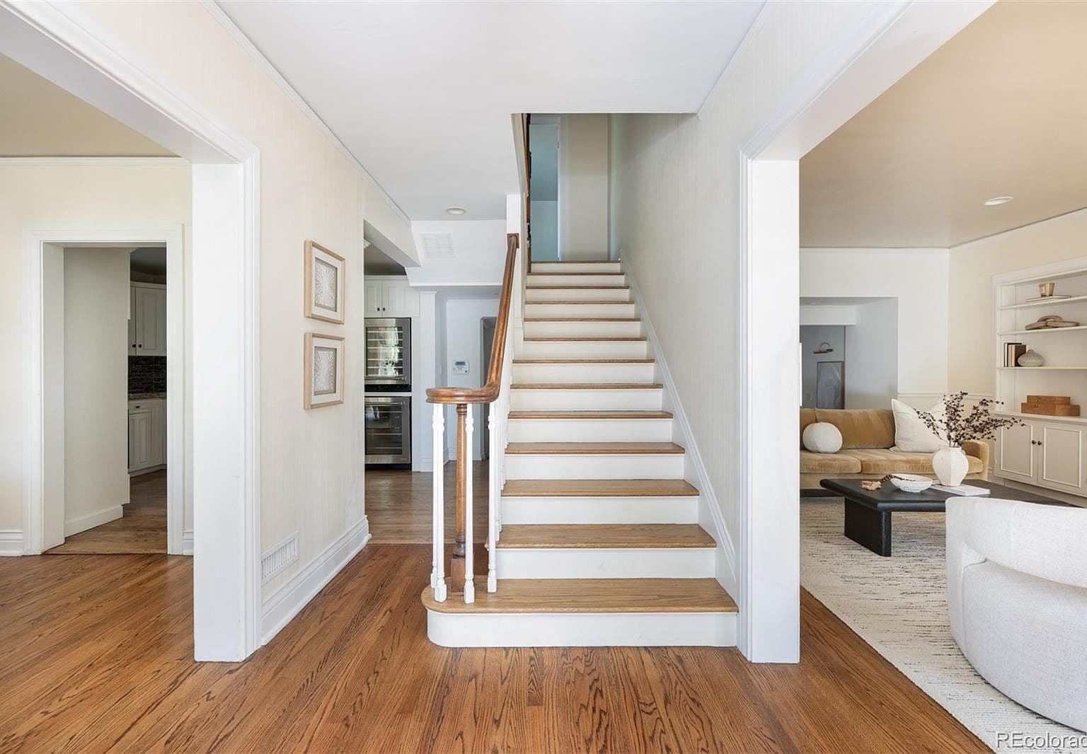 Central staircase with oak treads and classic white banister