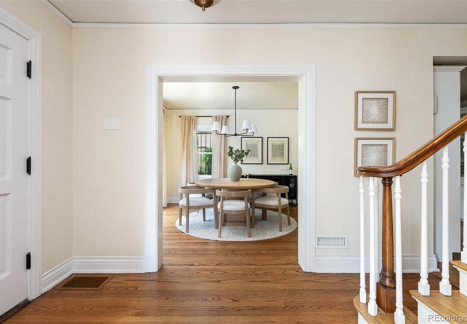 Entry hall opening to formal dining room