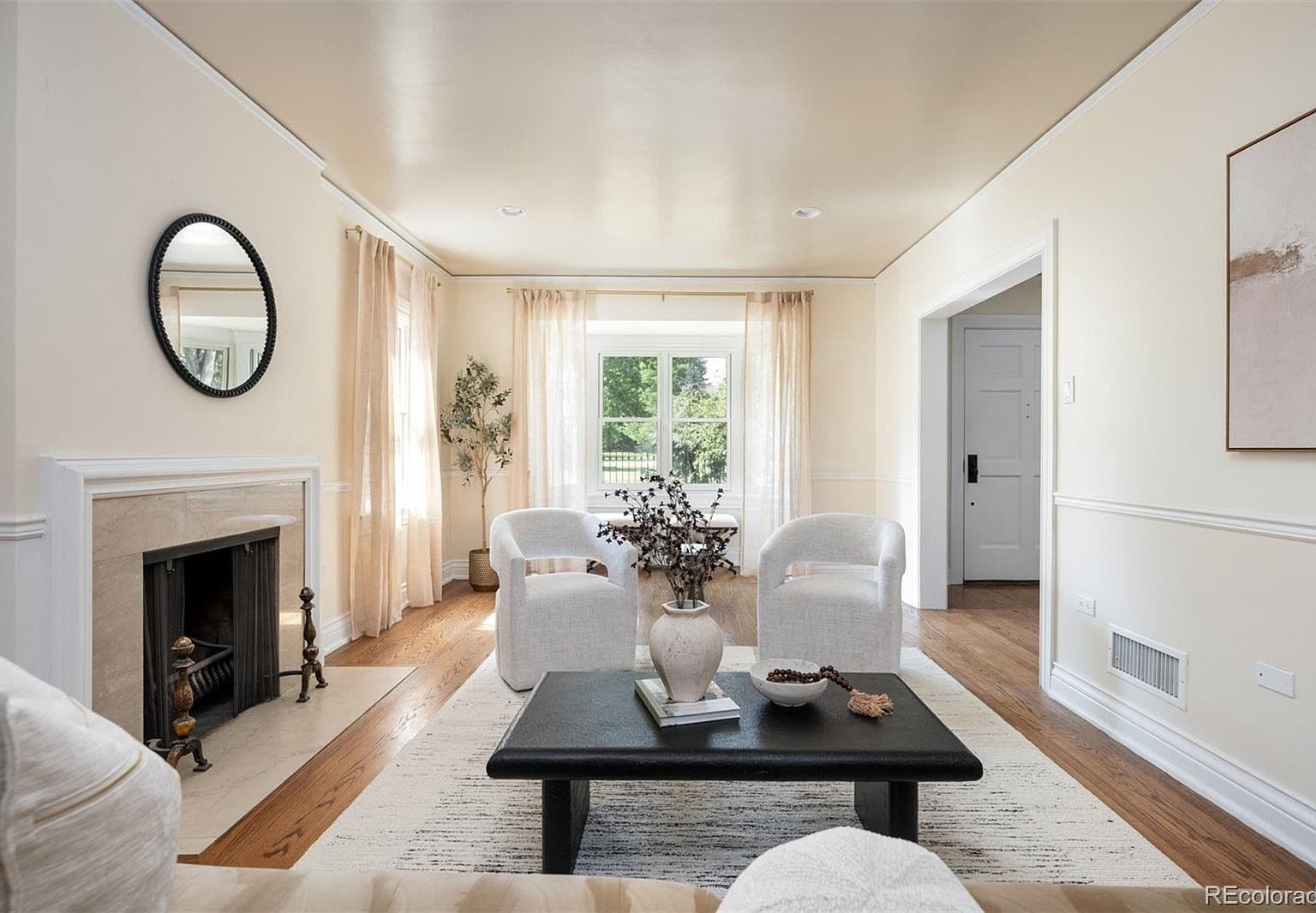 Family room with navy herringbone tile fireplace wall