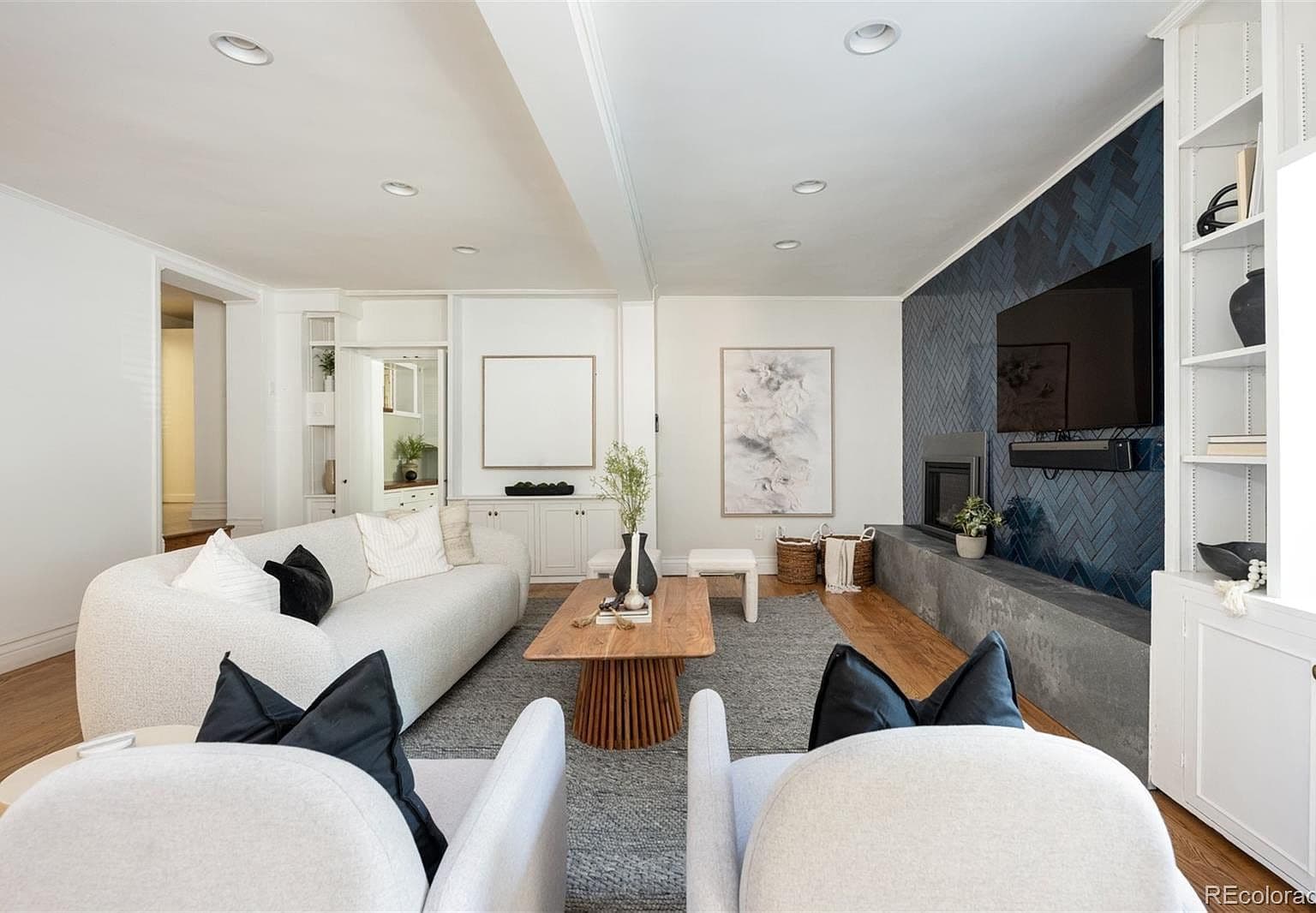 Spacious family room with dual seating and accent fireplace