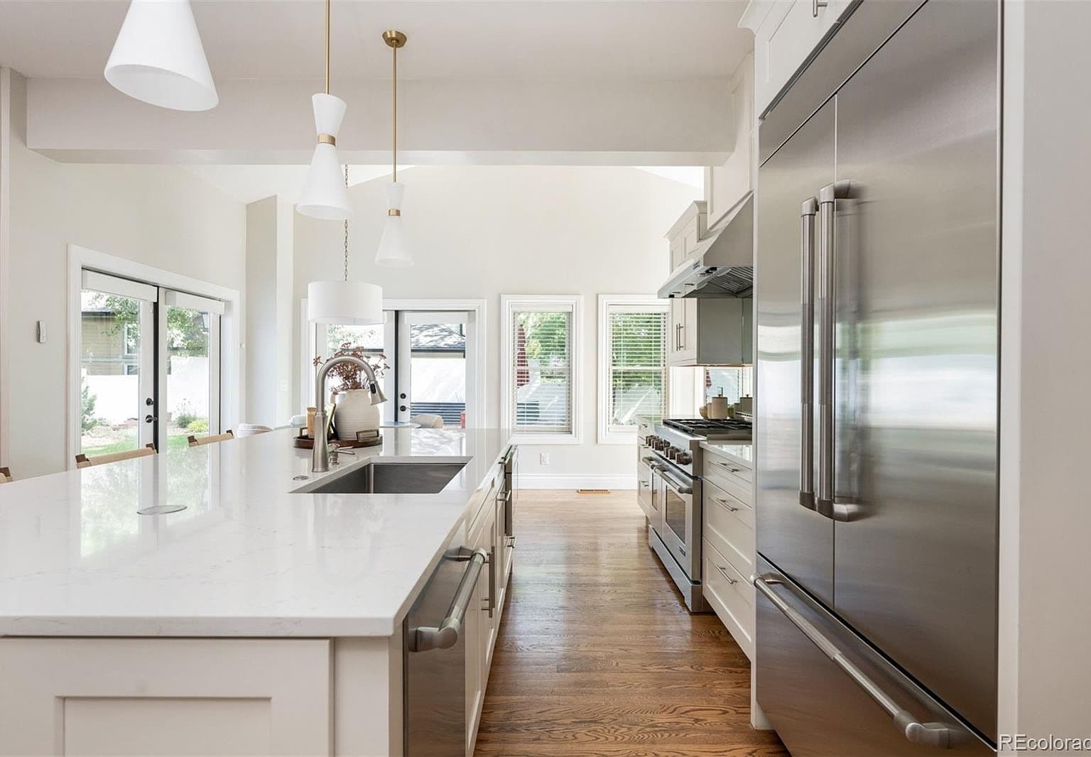 Oversized island with prep sink and stainless appliances