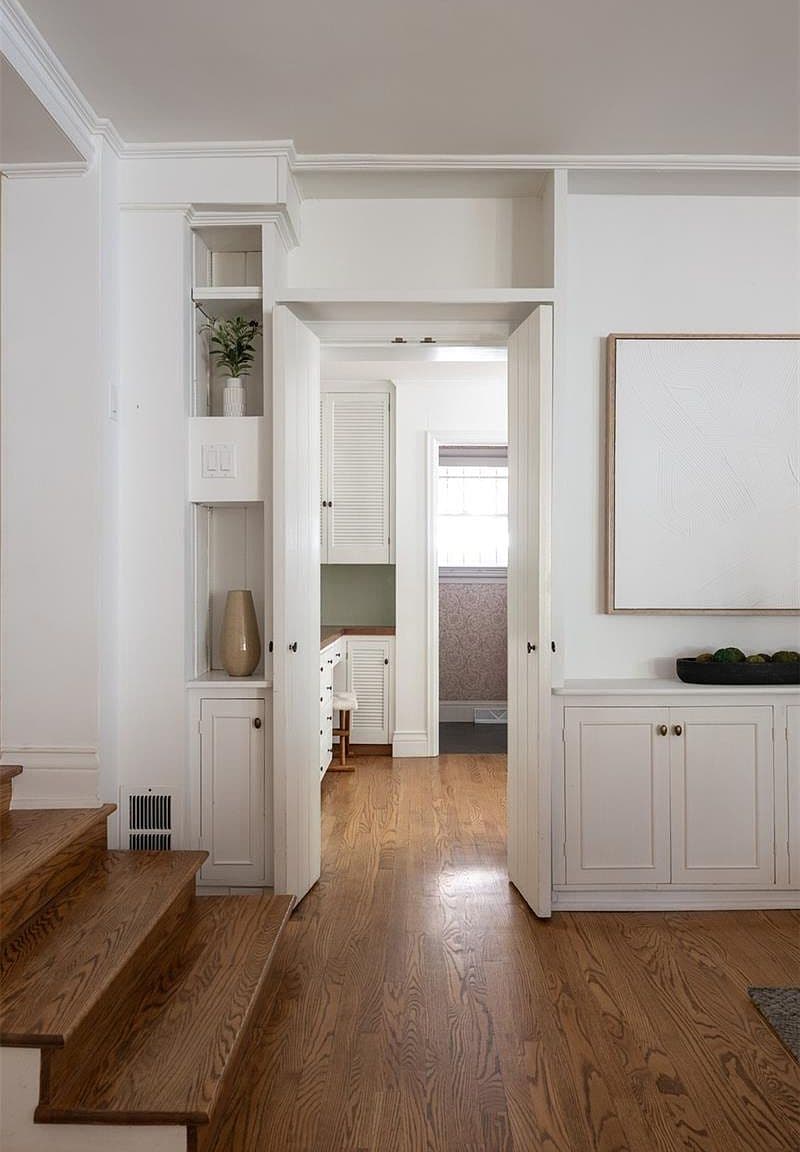 Built-in cabinetry hallway leading to catering kitchen