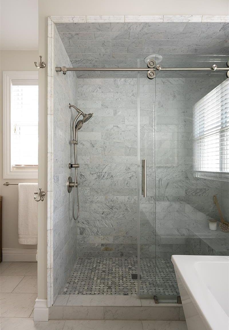 Marble shower with bench and rain fixtures