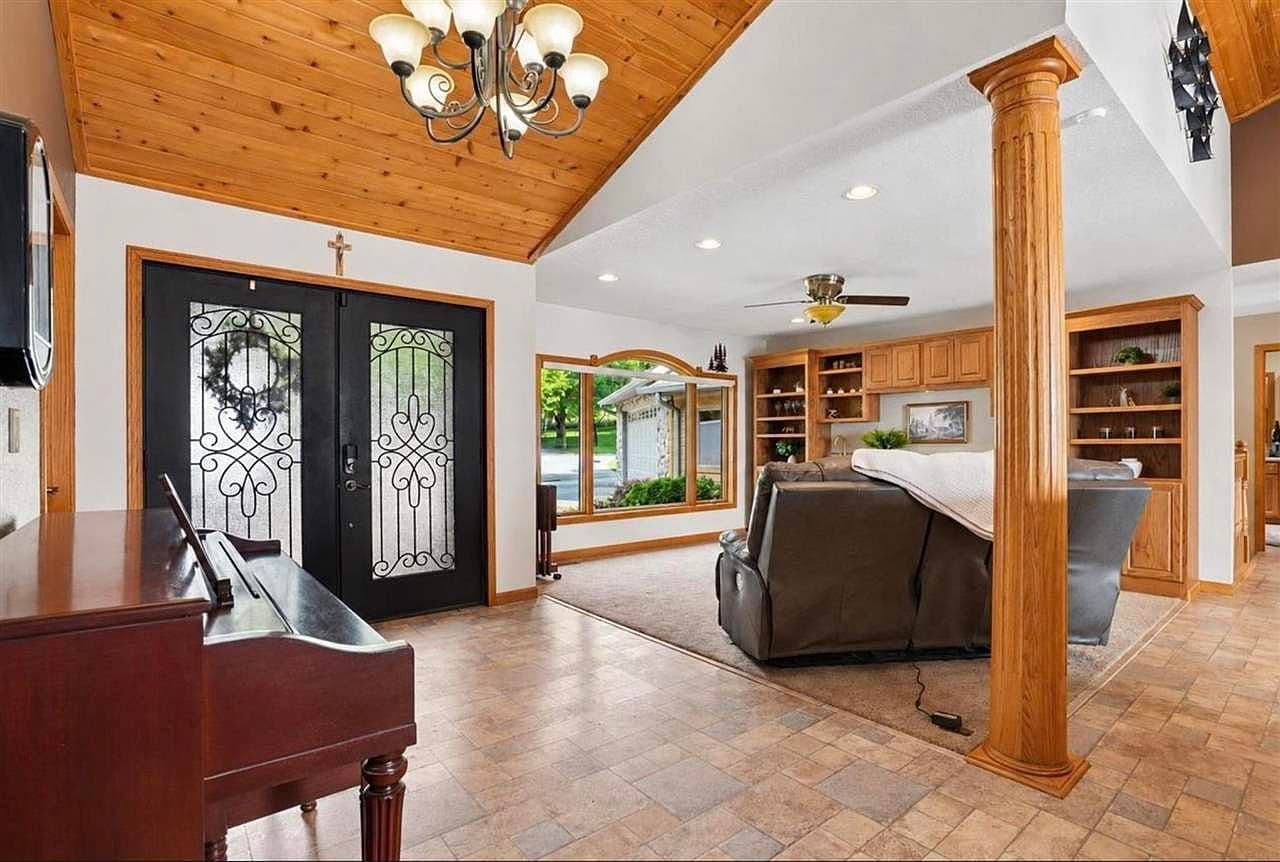 Inviting entry with warm knotty-pine vaulted ceiling.