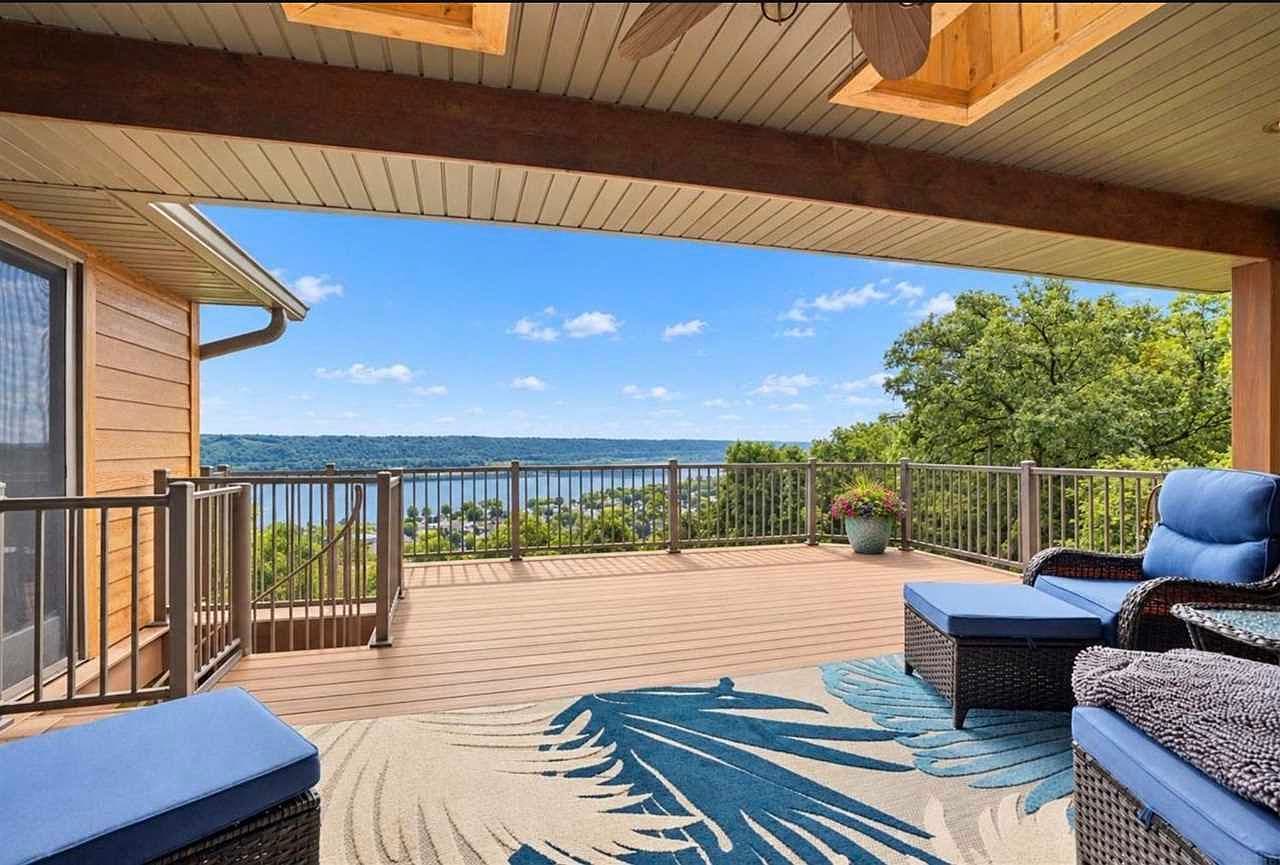 Expansive deck showcases breathtaking river and city vistas.