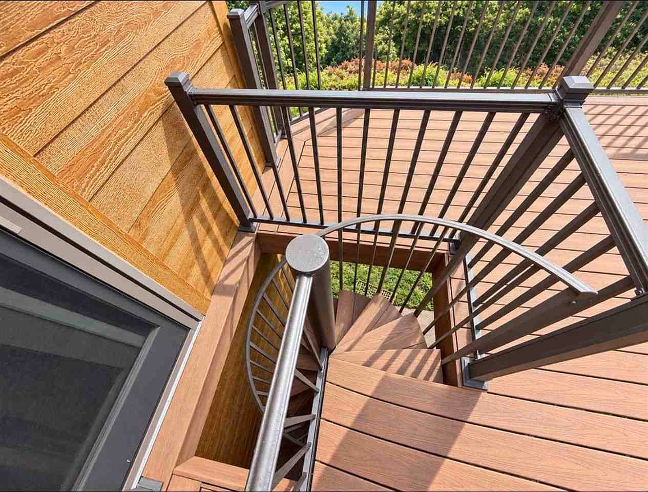 Spiral staircase connects deck levels for effortless entertaining.