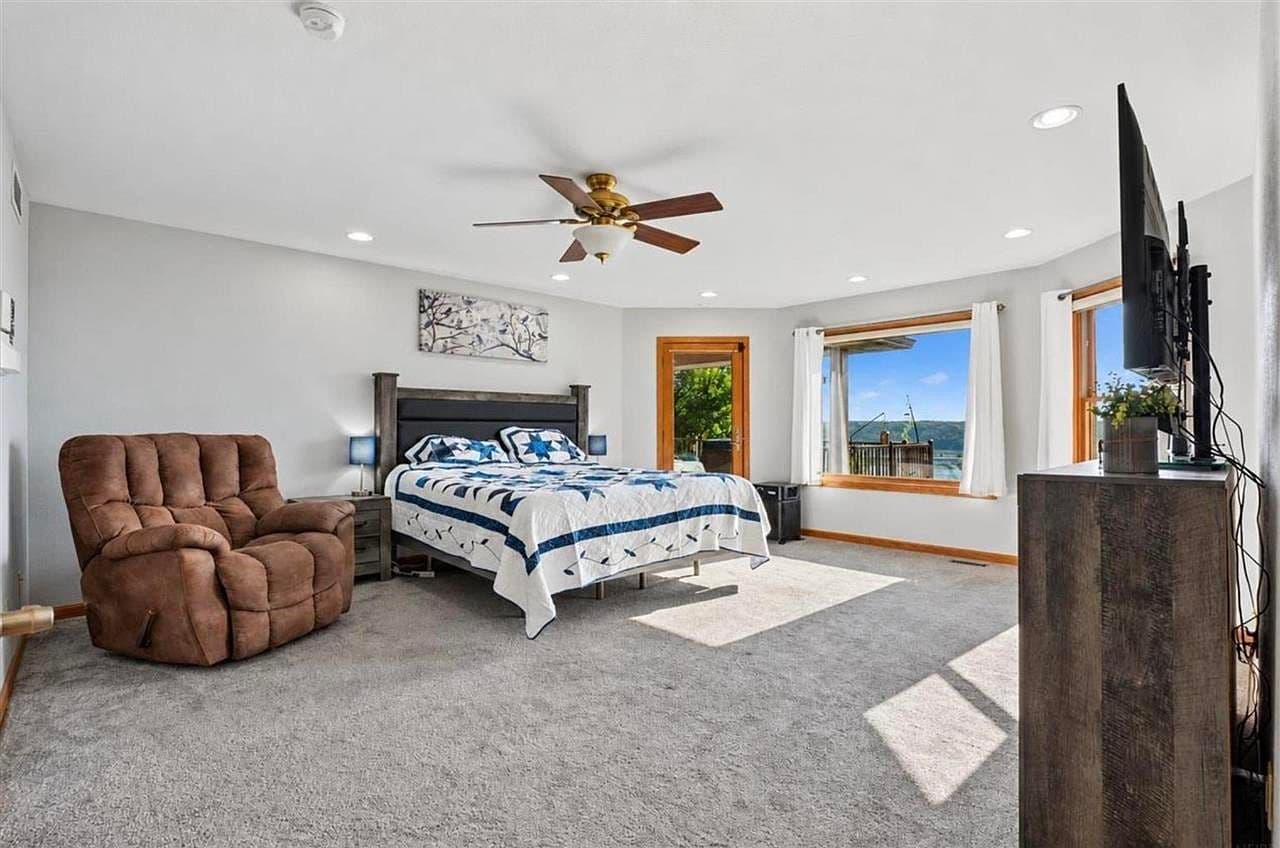 Wake up to serene Mississippi River views from bed.