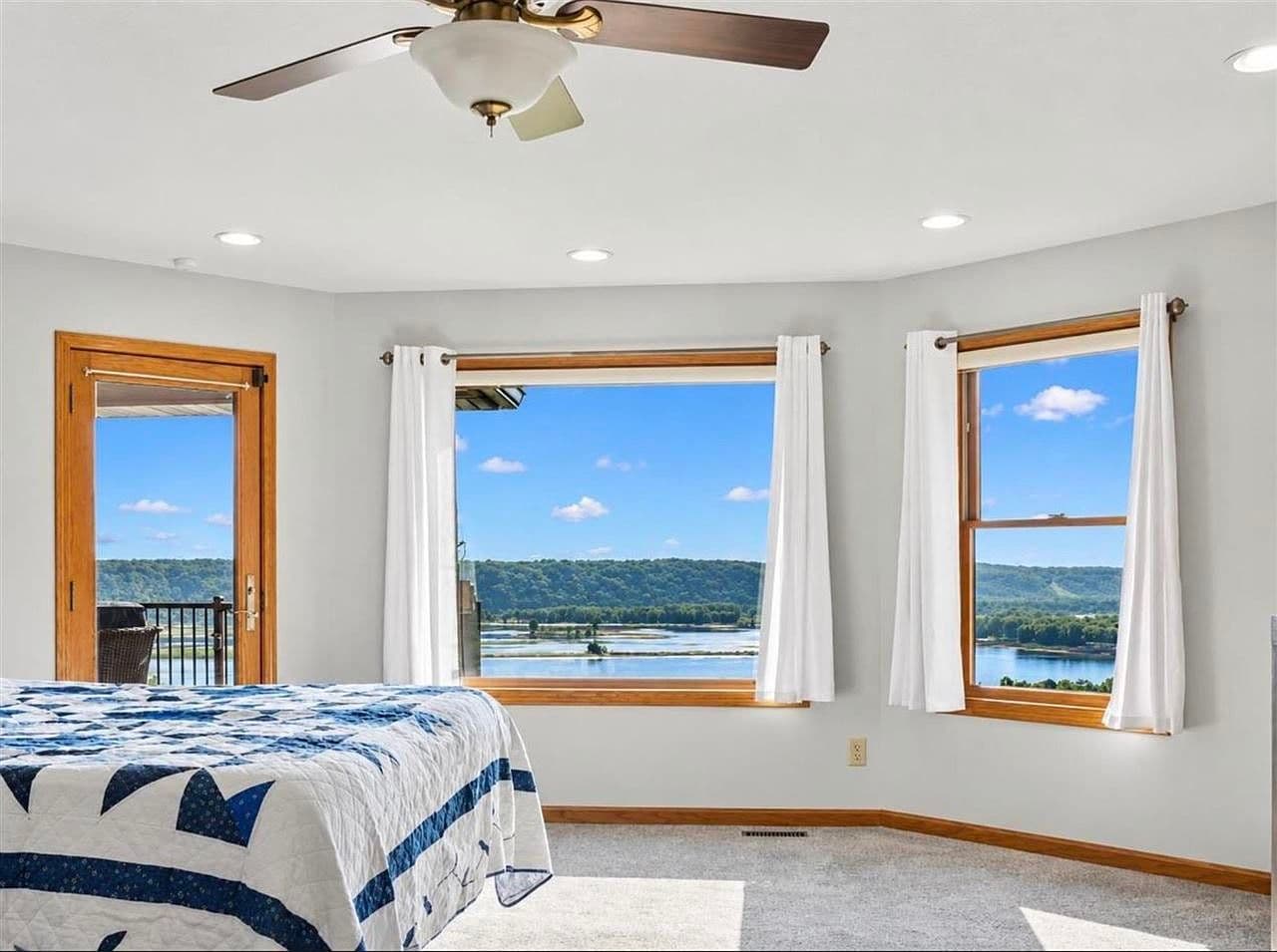 Spa-like bath with soaking tub and scenic river view.