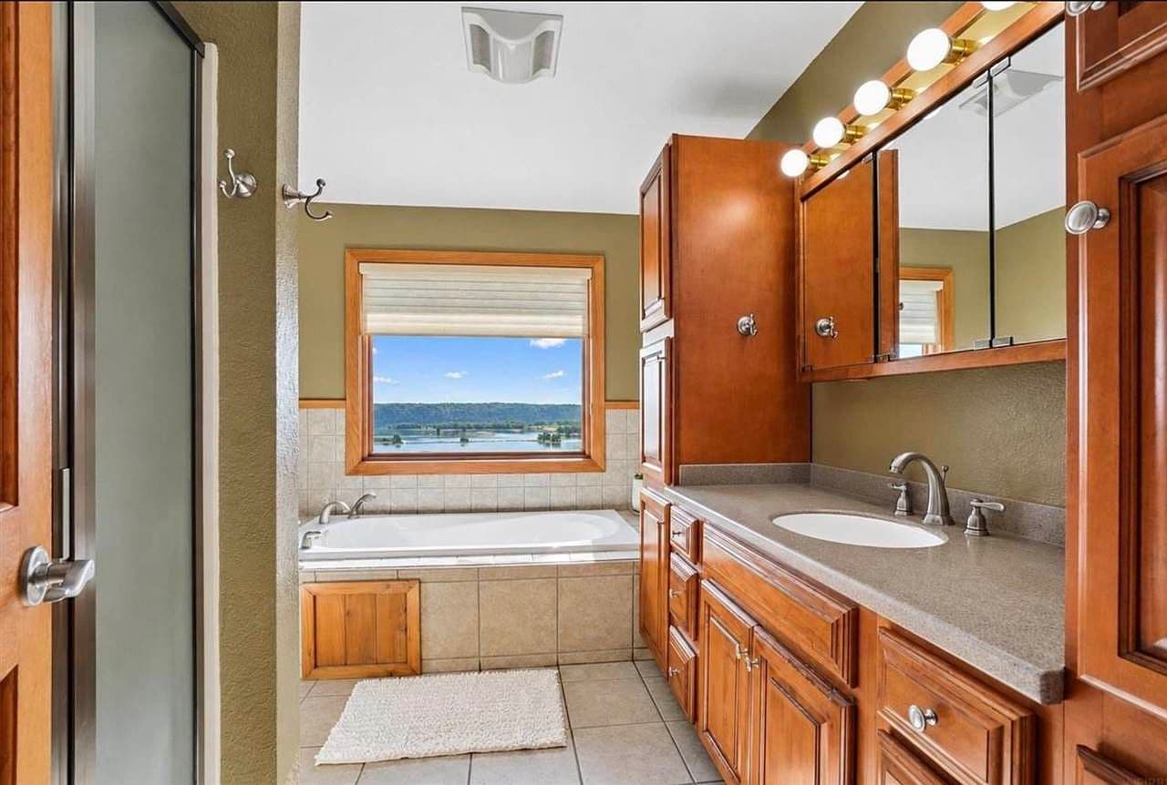 Dual-sink vanity and ample storage for easy mornings.