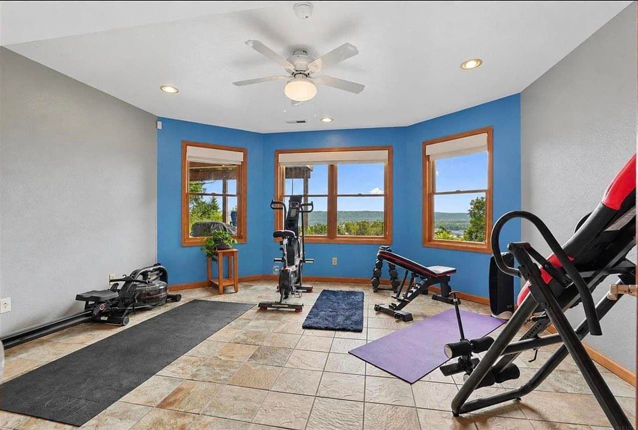 Bright home gym with inspiring Mississippi River vistas.