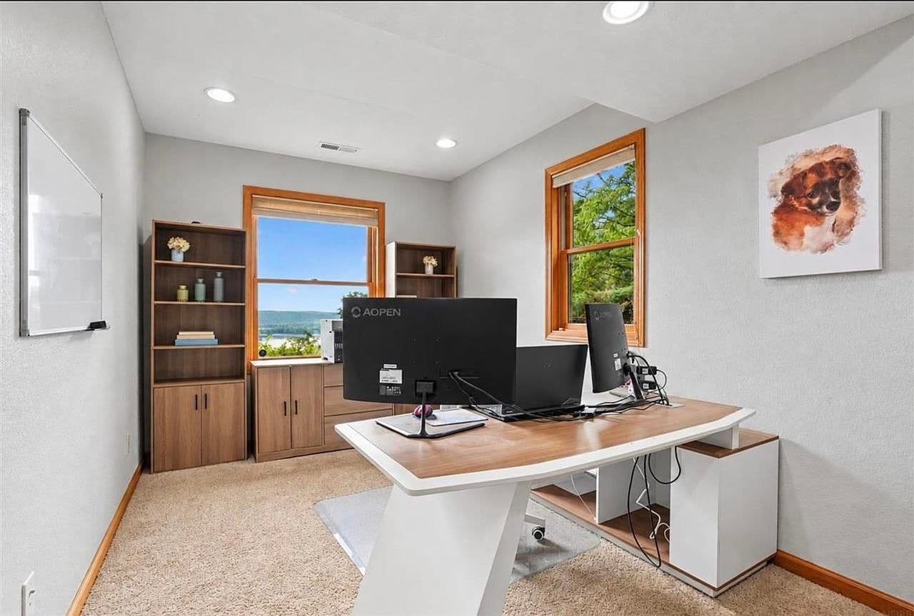 Work-from-home office with panoramic river and bluff views.