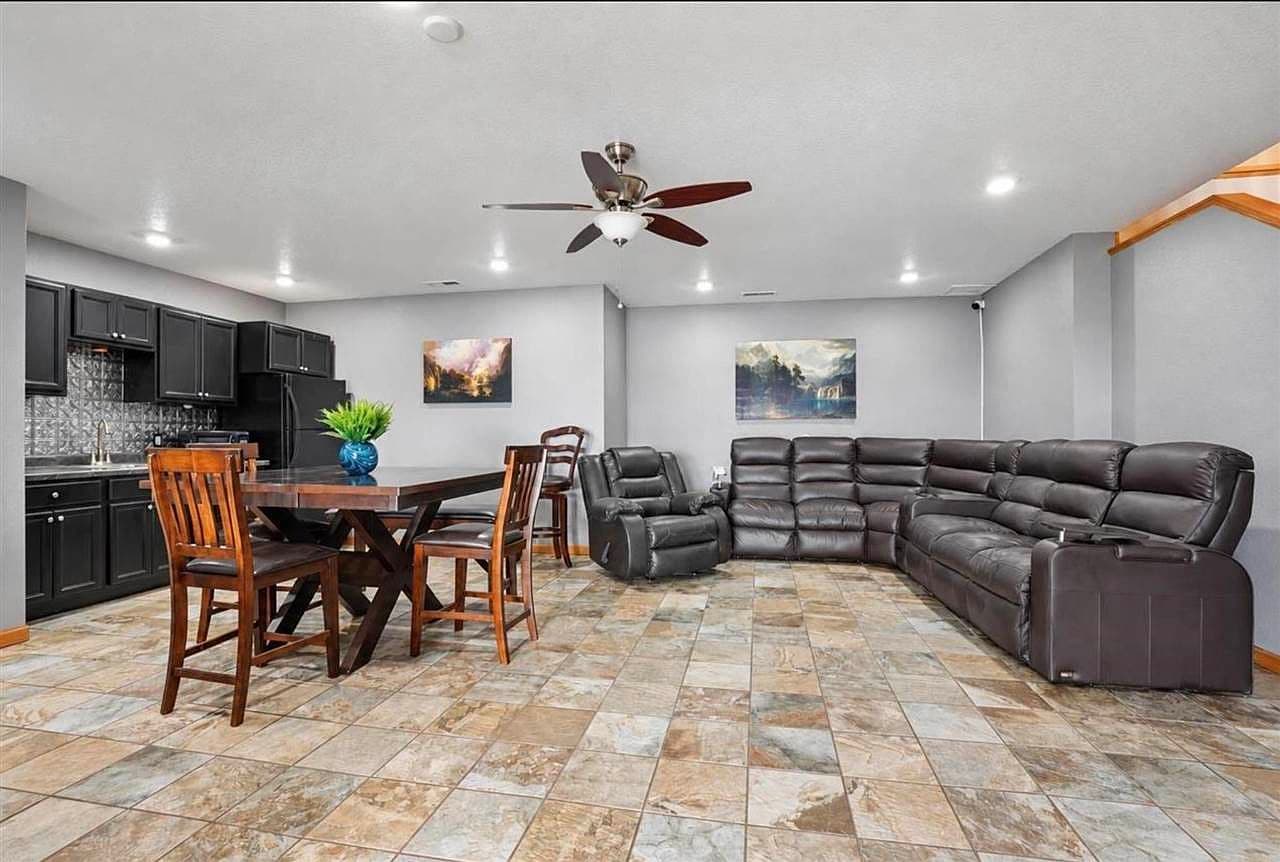Lower-level family room with wet bar for entertaining.