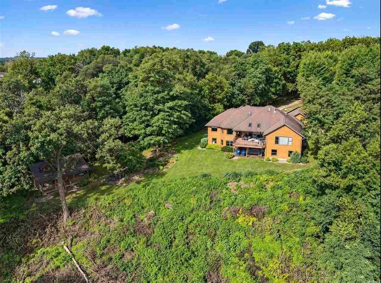 Secluded wooded estate with private cabin and lawn.