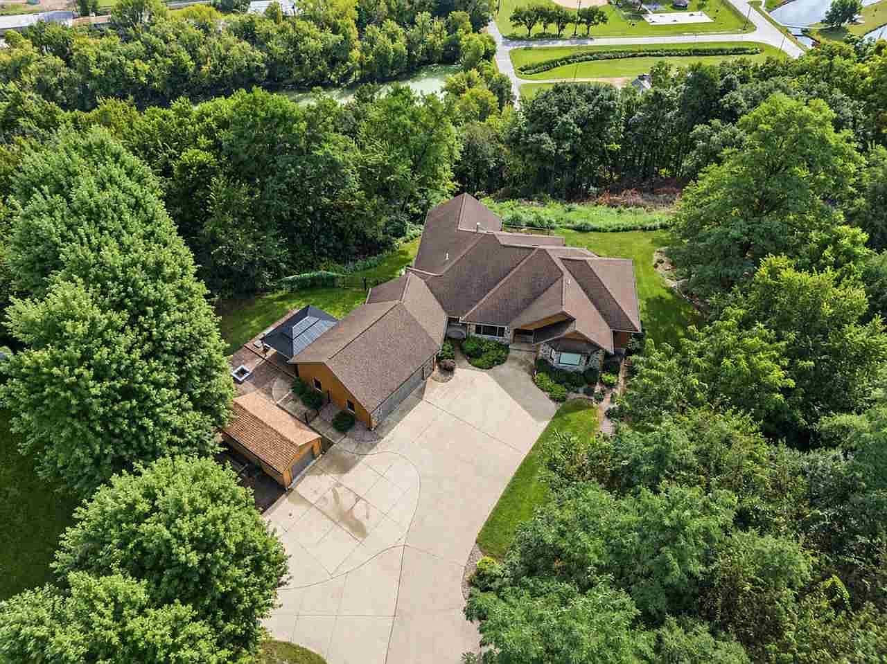 Aerial privacy with oversized garage, minutes to river views.